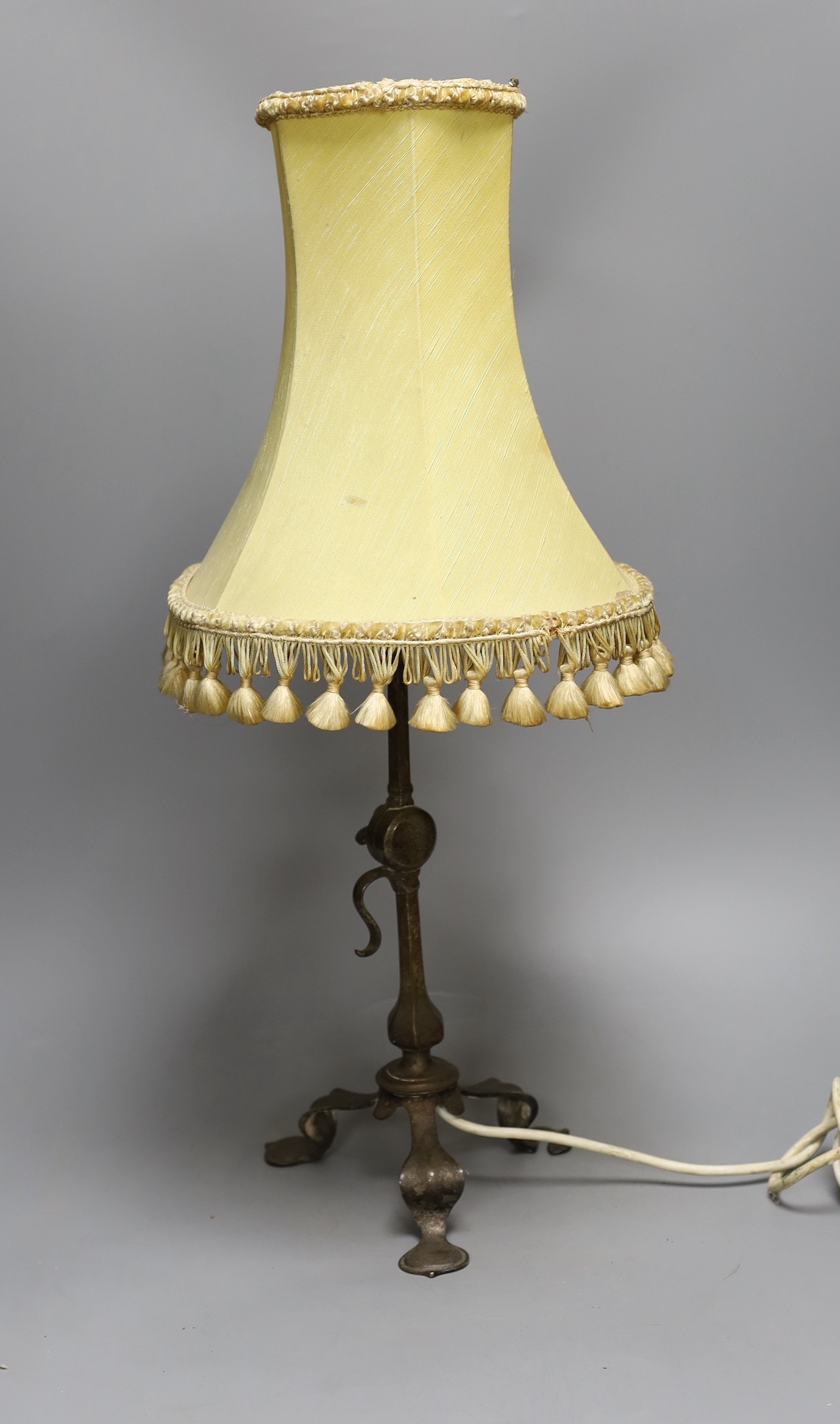 An Arts & Crafts style adjustable metal desk lamp, 33.5 cms high